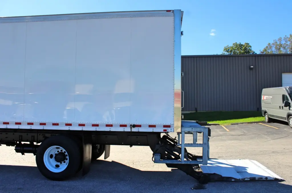2016 Freightliner M2-106 Box Truck – opposite-side rear section of Morgan box body with hydraulic liftgate lowered to the ground.