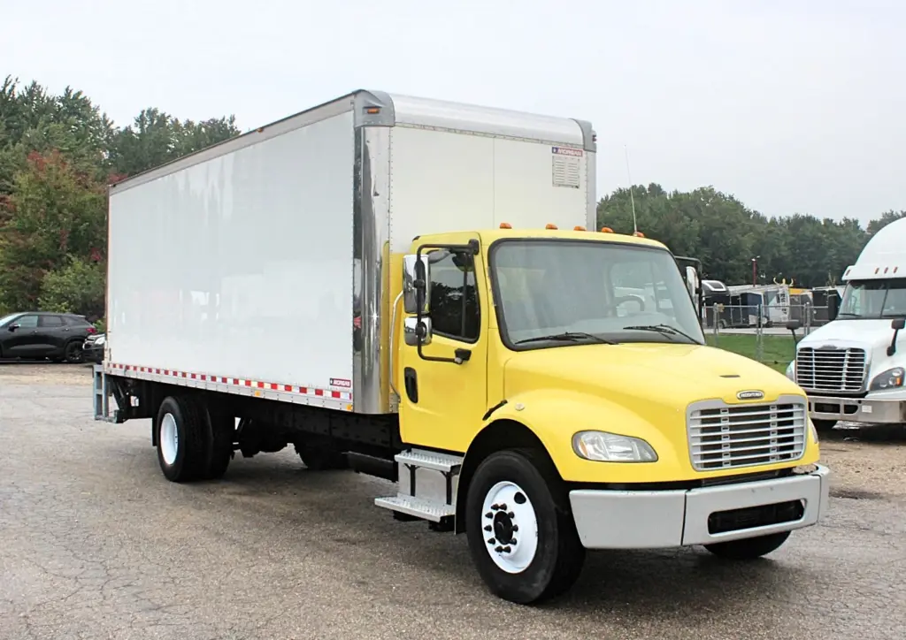 2016 Freightliner M2-106 box truck – front passenger-side exterior view with yellow cab and Morgan box