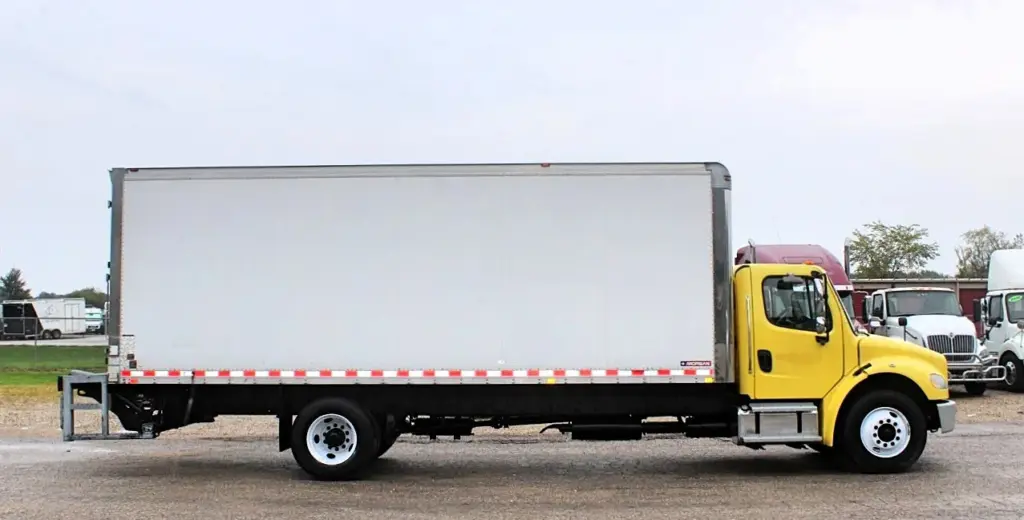 2016 Freightliner M2-106 box truck – passenger-side profile showing Morgan cargo box and single rear axle