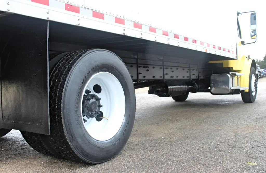 2016 Freightliner M2-106 box truck – rear wheel and chassis detail beneath Morgan cargo box