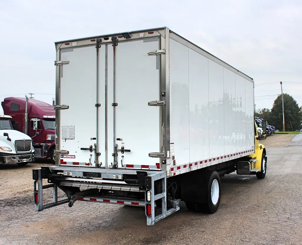 2016 Freightliner M2-106 box truck – rear passenger-side view with Morgan box and Maxon liftgate