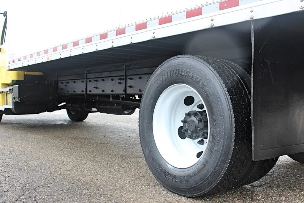2016 Freightliner M2-106 box truck – rear tire and wheel detail beneath cargo box