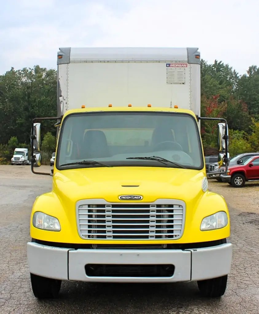 2016 Freightliner M2-106 box truck – straight-on front view of yellow Freightliner commercial truck