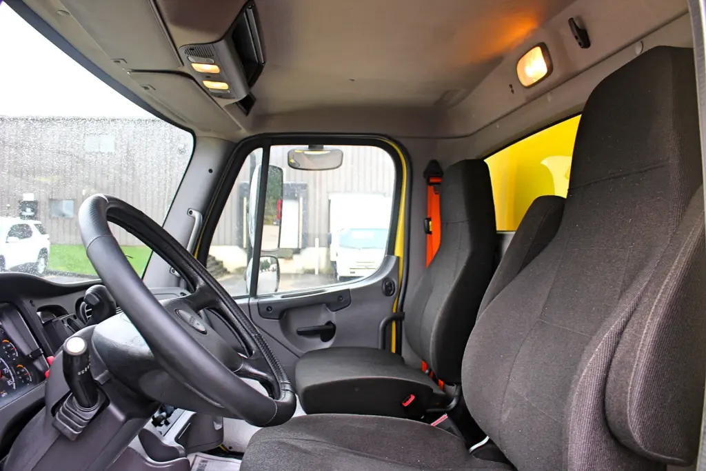2016 Freightliner M2-106 box truck – cab interior showing driver and passenger seating