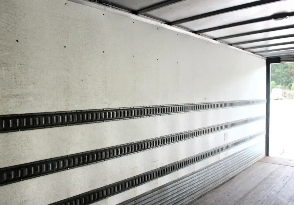 2016 Freightliner M2-106 box truck – interior cargo area with multiple E-track rows along side wall