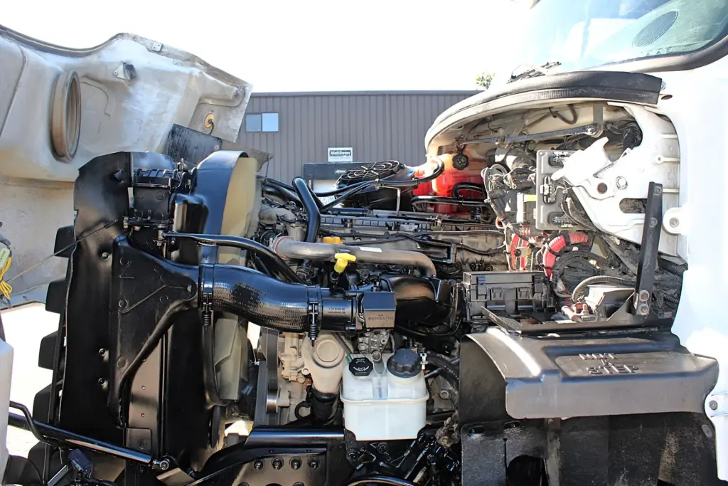 2018 Freightliner 114SD – heavy-duty diesel engine compartment with hood open.