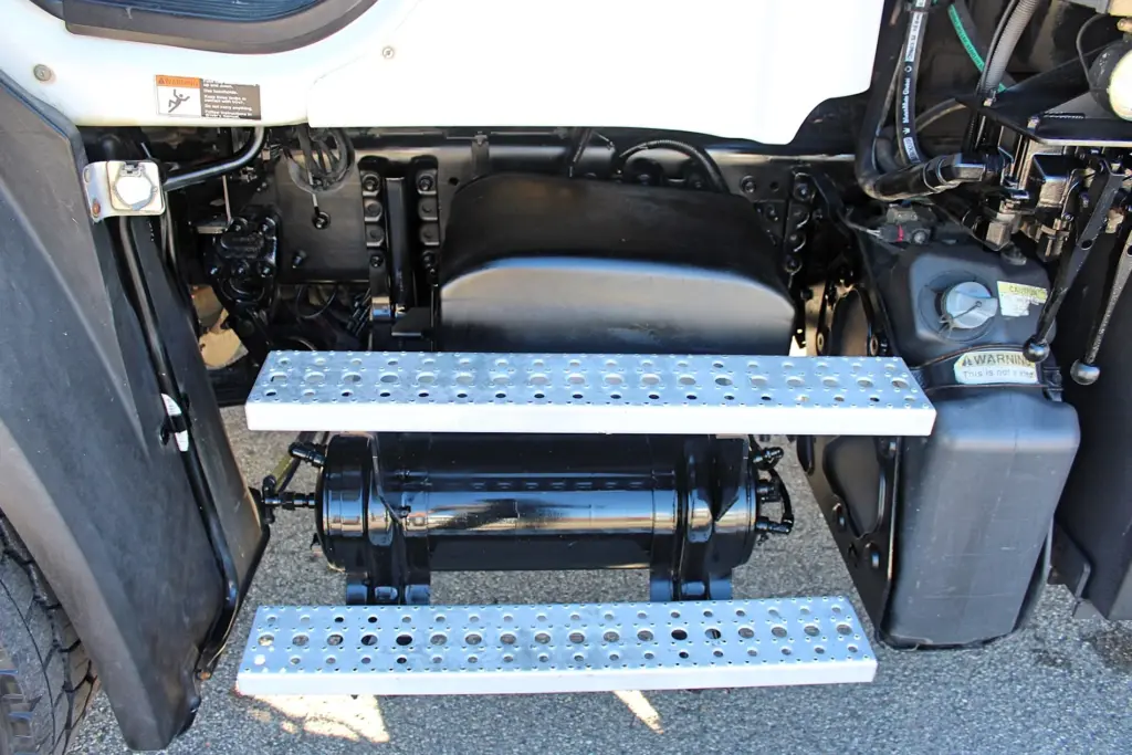 2018 Freightliner 114SD – heavy-duty cab entry steps and under-cab equipment.