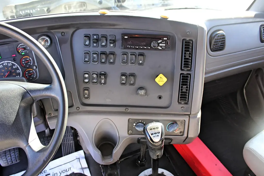 2018 Freightliner 114SD – dashboard control panel, climate controls and Eaton transmission shifter.