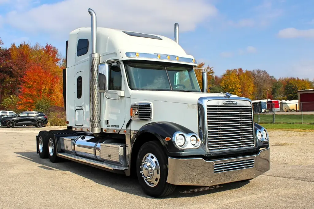 2018 Freightliner Coronado 132 — front three-quarter view of white sleeper tractor with chrome grille and stacks