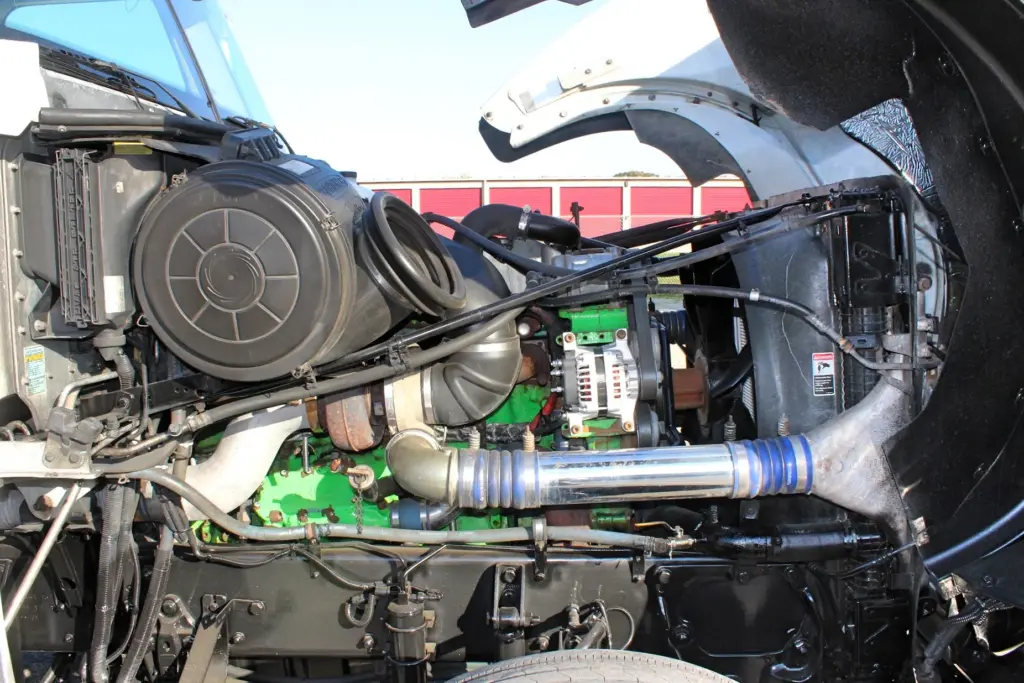 2018 Freightliner Coronado 132 — engine bay under raised hood with 12.7L Series 60 and silver intake tube