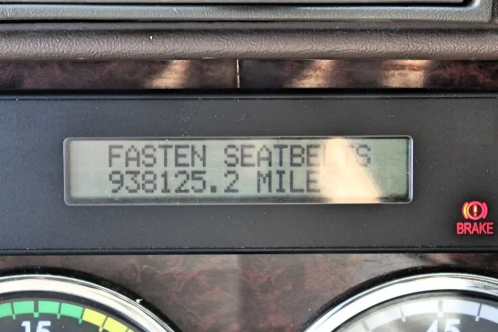 2018 Freightliner Coronado 132 — dash display showing fasten seatbelts, 938125.2 miles and red brake light
