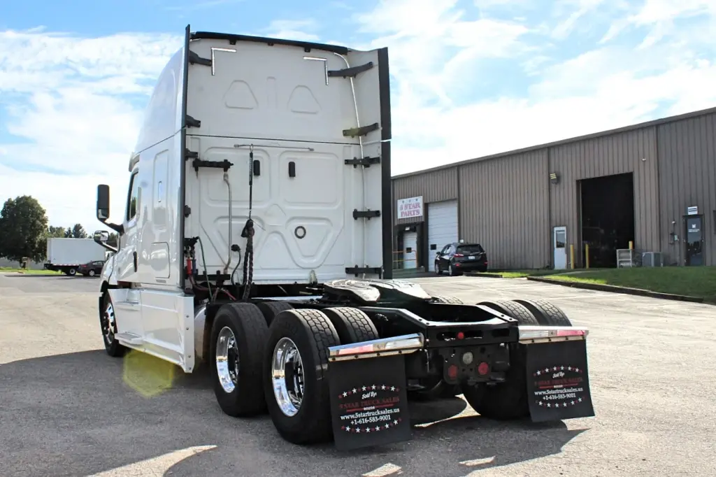 2019 Freightliner Cascadia 126 – rear three-quarter chassis view with fifth wheel and dual tires.