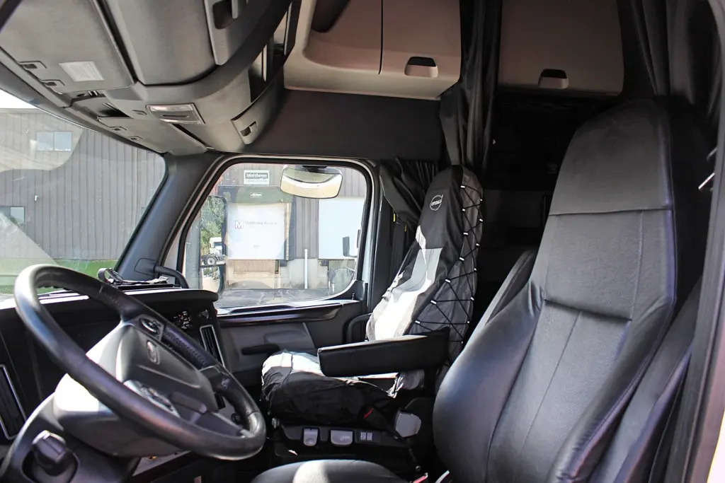 2019 Freightliner Cascadia 126 – driver and passenger seating inside sleeper cab.