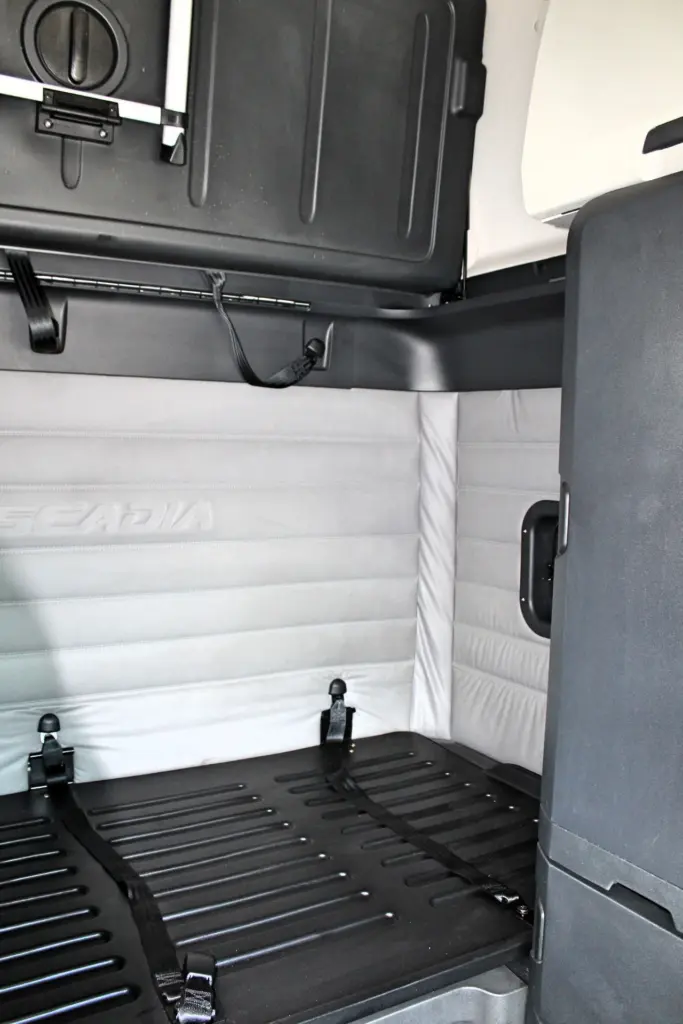 2019 Freightliner Cascadia 126 – sleeper cab lower bunk area with interior storage cabinet.
