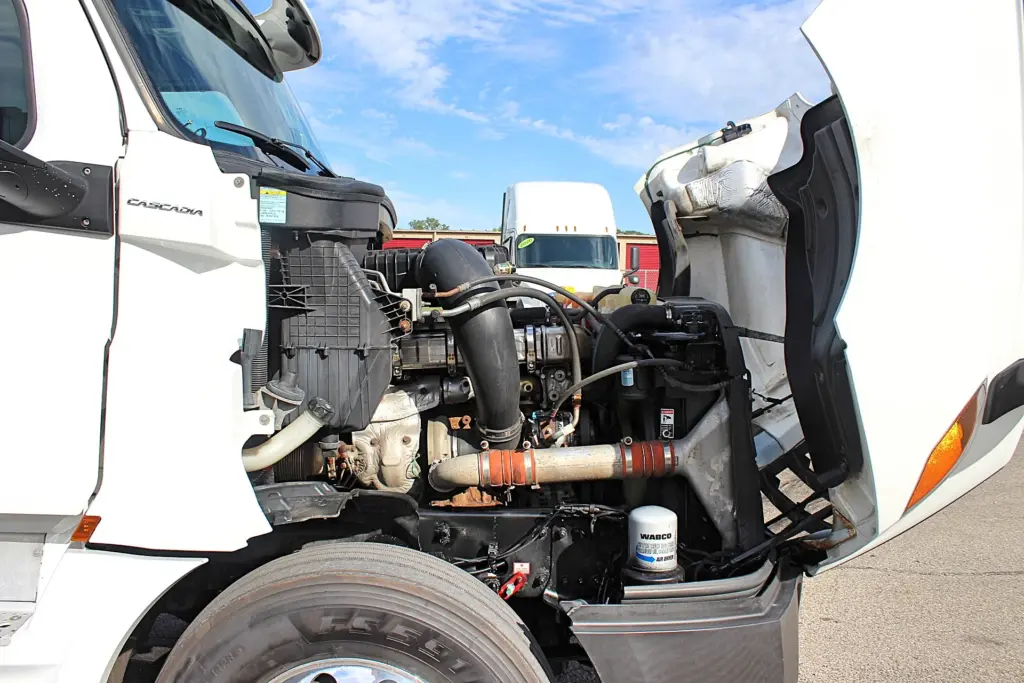 2019 Freightliner Cascadia 126 – opposite-side engine bay view with hood open.