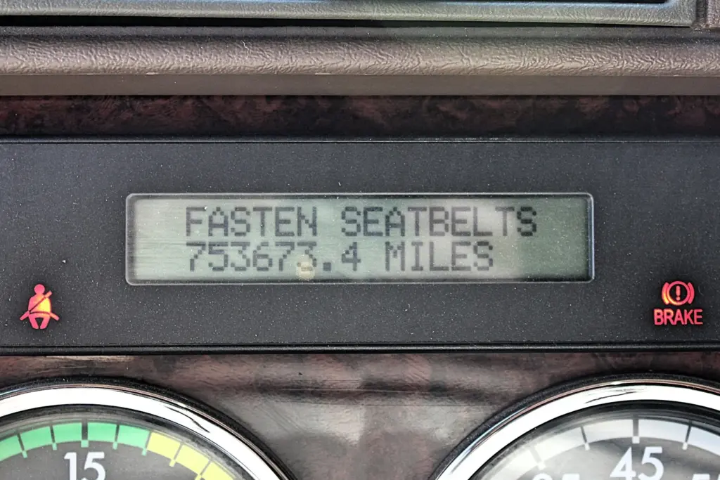 2020 Freightliner Coronado 132 — close view of digital display showing 753673.4 miles and seatbelt warning