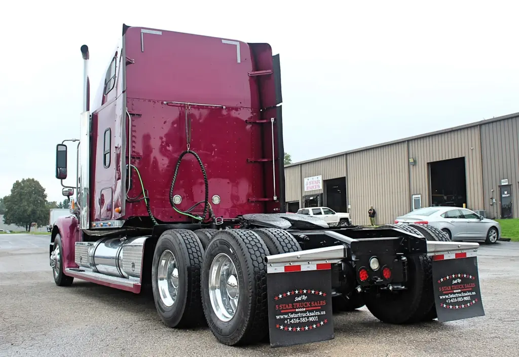2020 Freightliner Coronado 132 Glider – rear driver-side view of burgundy sleeper tractor