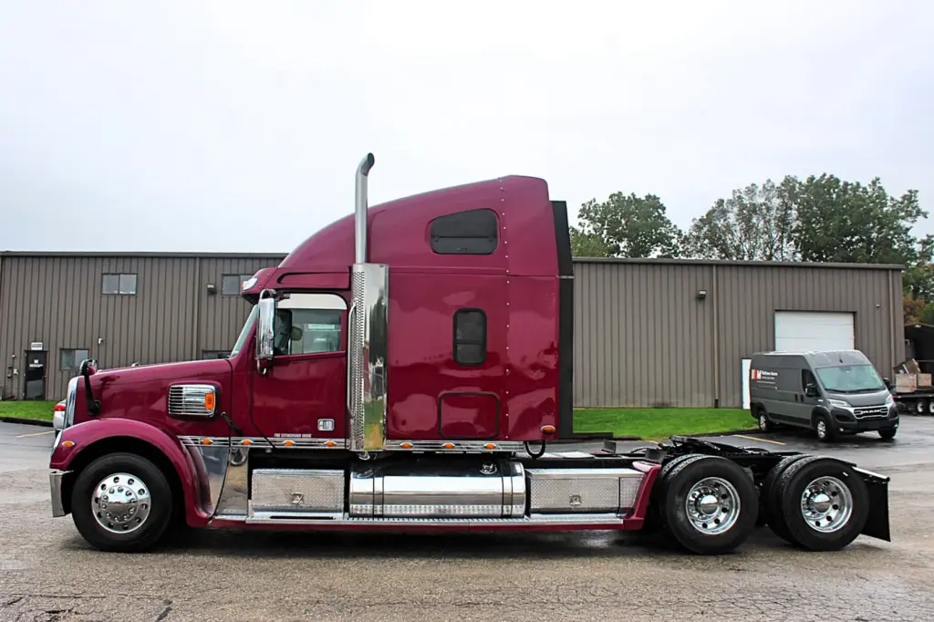 2020 Freightliner Coronado 132 Glider – full driver-side profile of burgundy sleeper semi truck