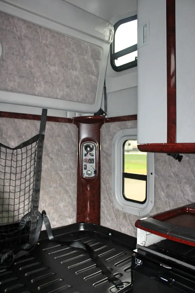 2020 Freightliner Coronado 132 Glider – sleeper compartment with bunk, storage and rear climate controls