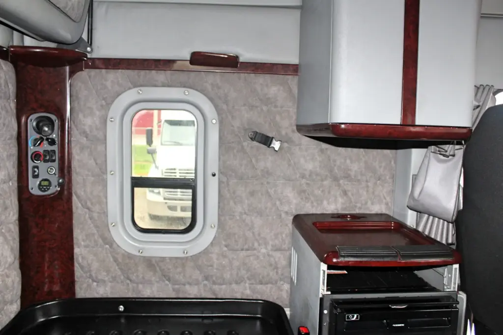 2020 Freightliner Coronado 132 Glider – sleeper storage cabinets, side window and quilted interior trim