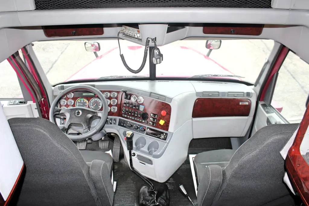 2020 Freightliner Coronado 132 Glider – sleeper view looking forward at dashboard and front seats