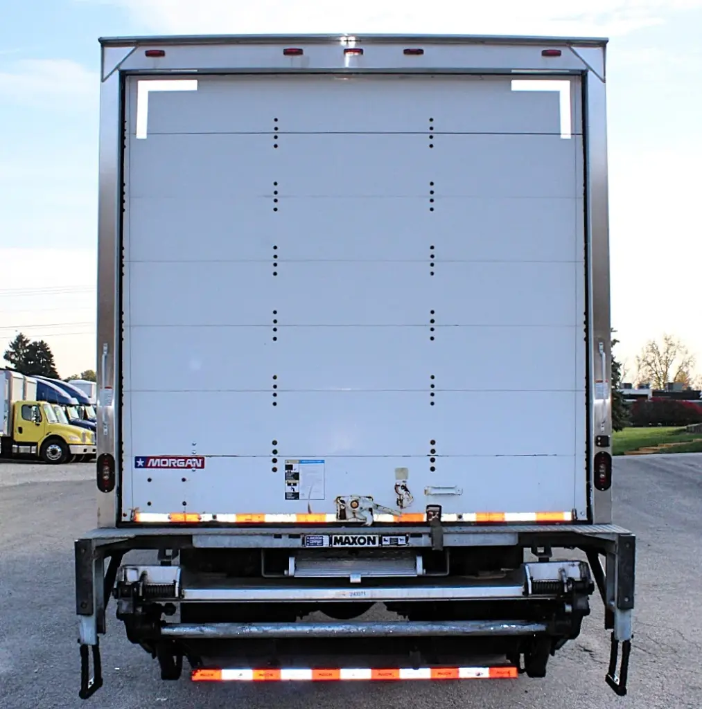 2020 Freightliner M2 106 — straight-on rear view of the white box body, with dual tail lights and a lowered lift gate.