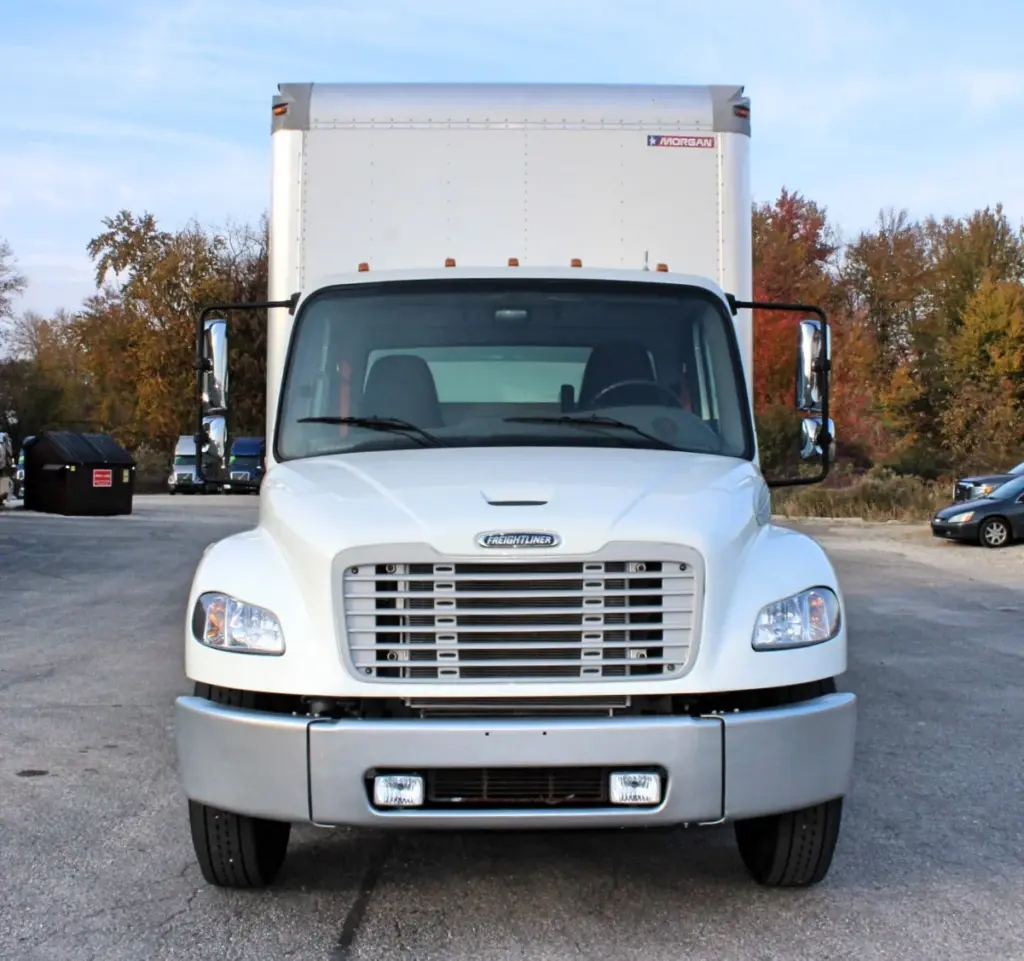 2020 Freightliner M2 106 — straight-on head-on view of white cab with windshield, mirrors and silver bumper under a box body