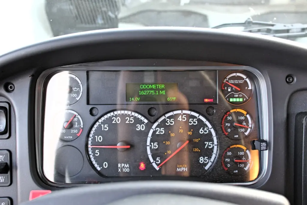 2020 Freightliner M2 106 — gauge cluster close-up with 162775.1 mile odometer, RPM and speed dials, air gauges