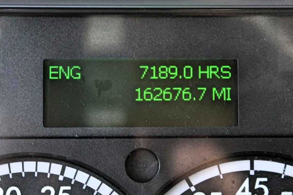 2020 Freightliner M2 — dash screen showing 7189.0 engine hours and 162676.7 miles in green digits, straight on