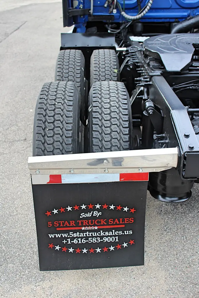 2020 Freightliner Cascadia 125 Glider – tandem drive tire tread and rear mudflap detail.