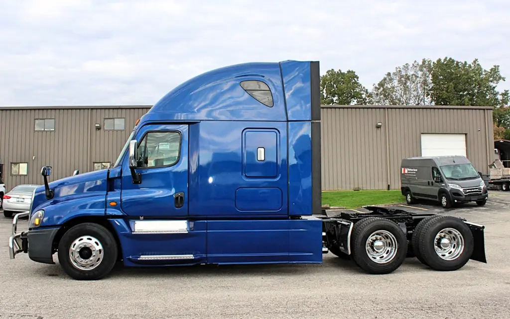 2020 Freightliner Cascadia 125 Glider – blue sleeper semi truck full side exterior view.
