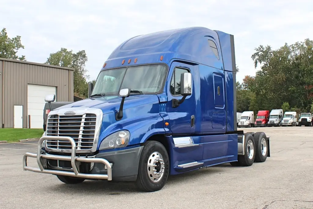 2020 Freightliner Cascadia 125 Glider – front three-quarter view with blue exterior and stainless steel grille guard.