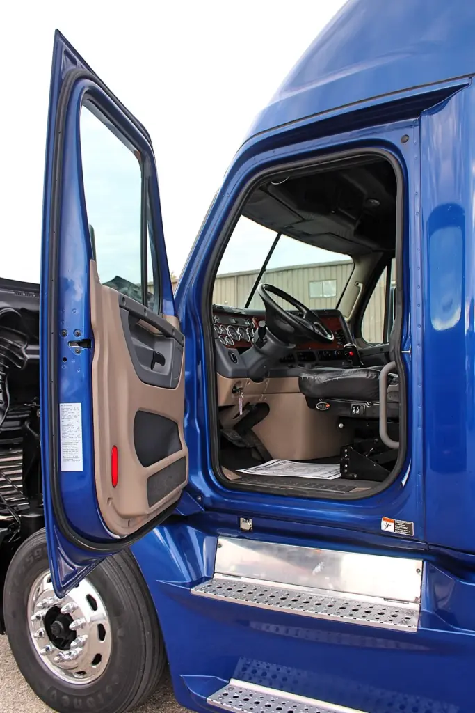 2020 Freightliner Cascadia 125 Glider – open driver door showing cab entry, steps and interior.