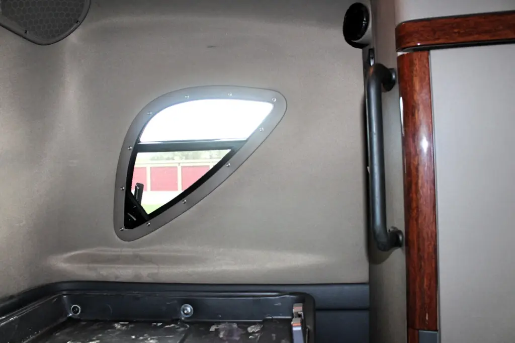 2020 Freightliner Cascadia 125 Glider – sleeper interior side window, cabinet and bunk area detail.