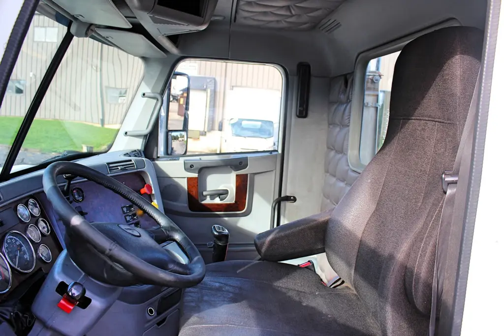 2020 Freightliner Columbia 120 Glider – driver door open showing cab entry and interior