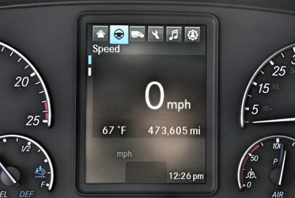 2021 Freightliner Cascadia 126 — close view of dash screen showing 0 mph, 473,605 mi and 67°F beside gauges