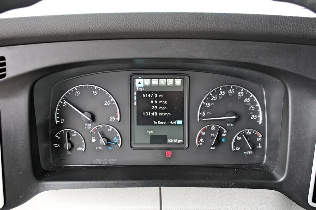 2021 Freightliner Cascadia 126 — head-on view of instrument cluster showing 5147 mi trip reading and speedometer dials